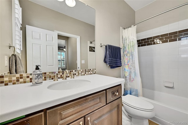 full bathroom with vanity, ceiling fan, toilet, and shower / tub combo