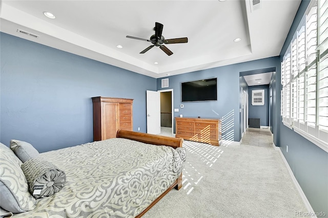 bedroom featuring ceiling fan and light colored carpet