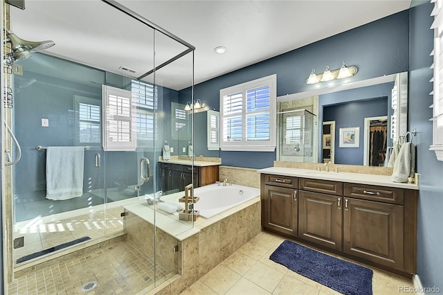 bathroom featuring vanity, tile patterned floors, and independent shower and bath