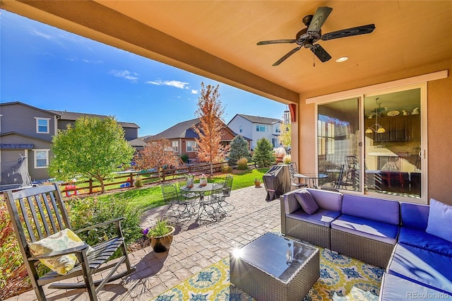 view of patio / terrace with ceiling fan and an outdoor living space