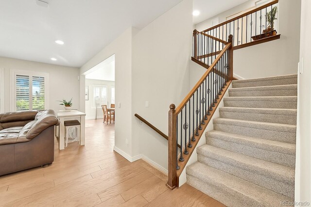 14672 Melco Ave, Parker, CO 80134 - stairway featuring wood finished floors, recessed lighting, and baseboards