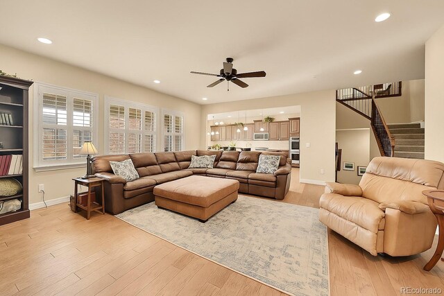 14672 Melco Ave, Parker, CO 80134 - living area with a ceiling fan, light wood-style flooring, stairway, recessed lighting, and baseboards