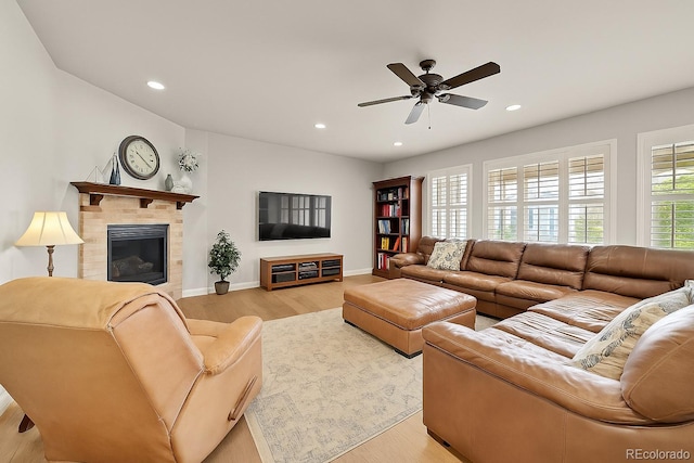 14672 Melco Ave, Parker, CO 80134 - living room featuring light wood-type flooring, ceiling fan, recessed lighting, baseboards, and a tile fireplace