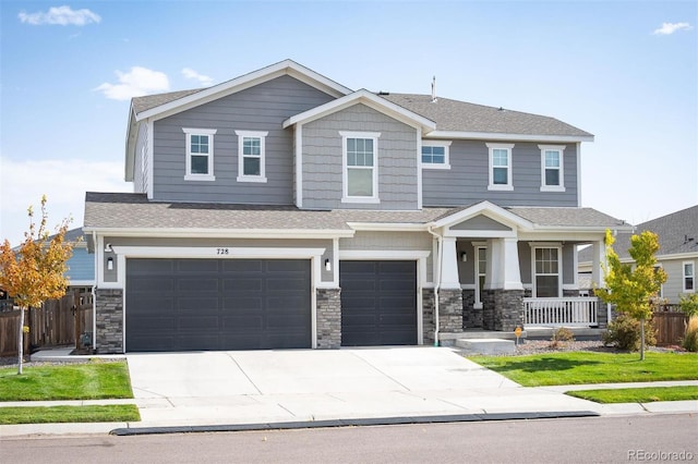 craftsman house with a garage and covered porch