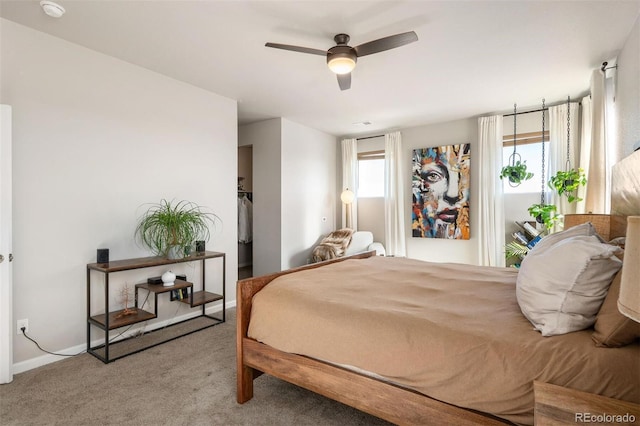 bedroom featuring light colored carpet and ceiling fan