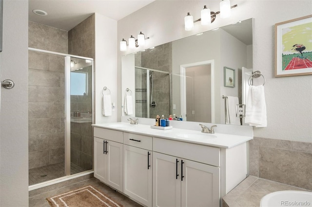 bathroom with shower with separate bathtub and vanity