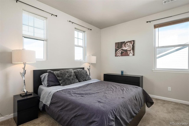 bedroom featuring light carpet