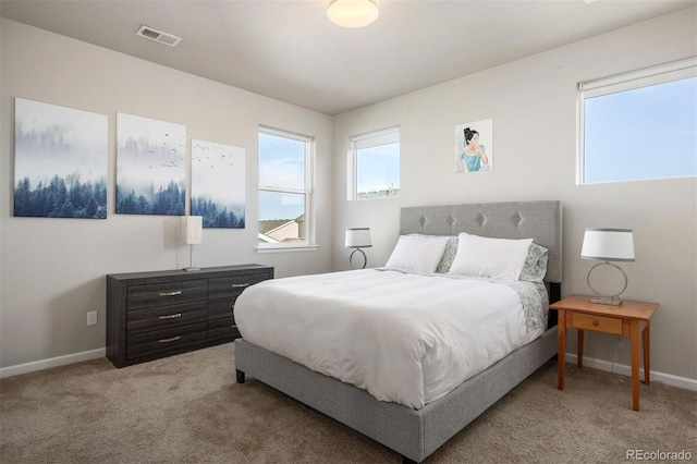 bedroom featuring light colored carpet