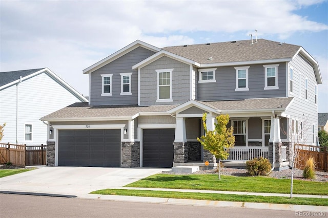 craftsman-style house with a front lawn, a garage, and covered porch