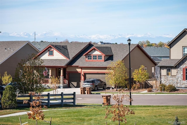 view of front of house featuring a garage and a front yard