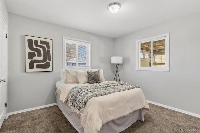 carpeted bedroom featuring baseboards