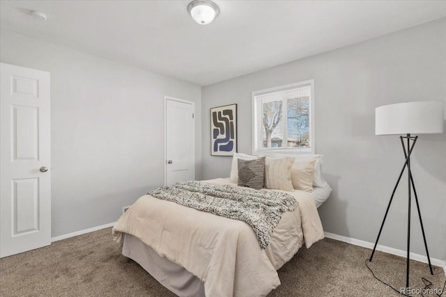 bedroom featuring carpet floors and baseboards