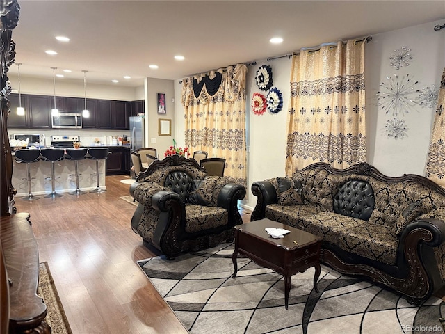 15600 Bolling, Denver, CO 80239 - living area with light wood-style flooring and recessed lighting