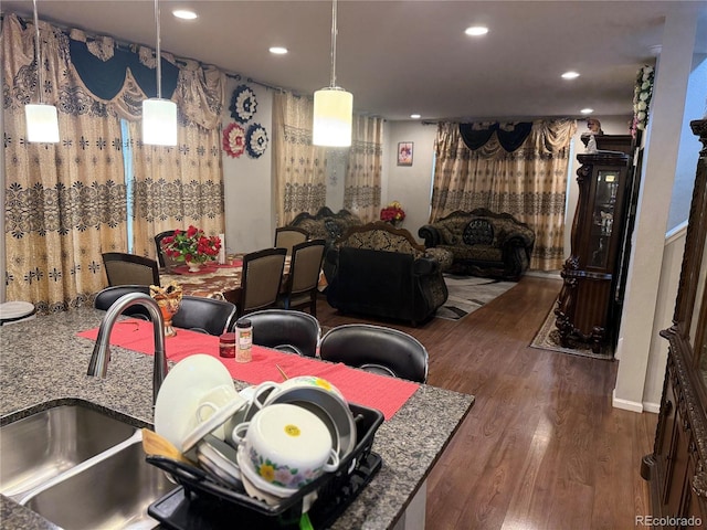 15600 Bolling, Denver, CO 80239 - dining room with wood finished floors and recessed lighting
