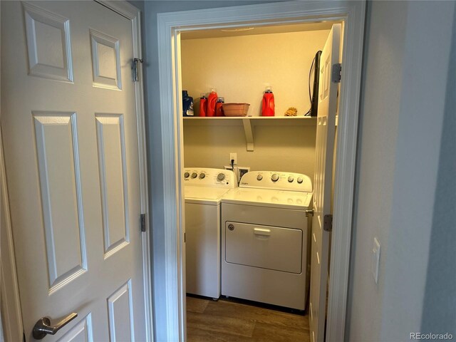 15600 Bolling, Denver, CO 80239 - laundry room featuring dark wood-type flooring and washing machine and clothes dryer
