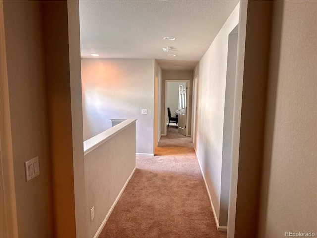 15600 Bolling, Denver, CO 80239 - hallway featuring light carpet, an upstairs landing, recessed lighting, and baseboards