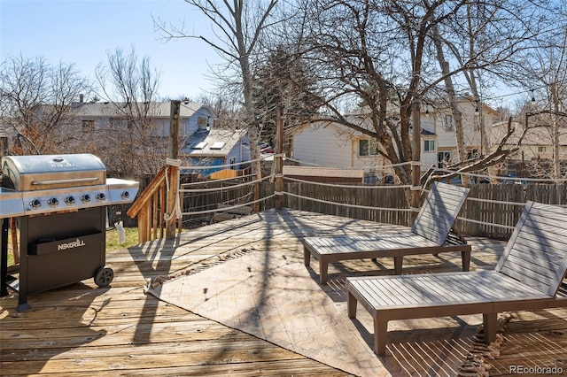 deck with grilling area and a residential view