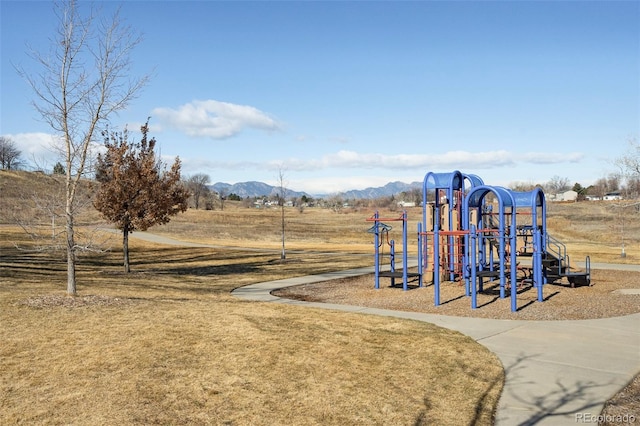 community jungle gym featuring a mountain view