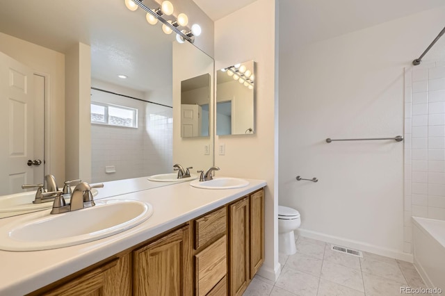 bathroom with toilet, tile patterned floors, double vanity, shower / bathtub combination, and baseboards