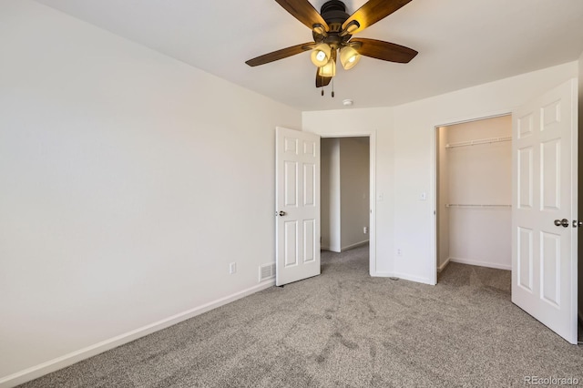 unfurnished bedroom featuring carpet flooring, baseboards, a closet, and ceiling fan