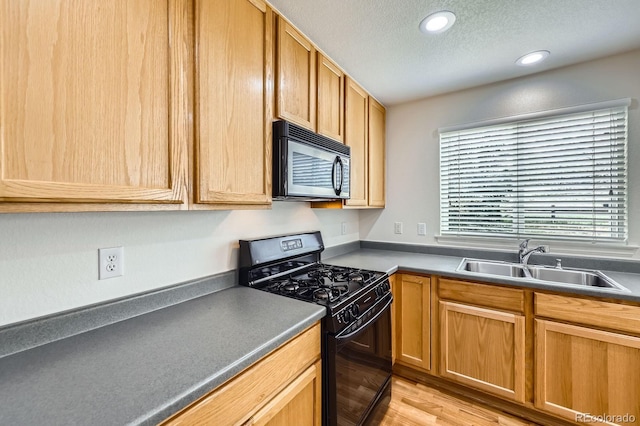 22030 Hill Gail Way, Parker, CO 80138 - kitchen featuring black appliances, a sink, a textured ceiling, light wood finished floors, and recessed lighting
