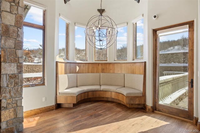 unfurnished sunroom with an inviting chandelier and a wealth of natural light