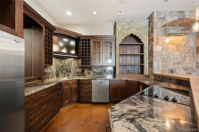 kitchen featuring stainless steel appliances, a sink, open shelves, glass insert cabinets, and pendant lighting