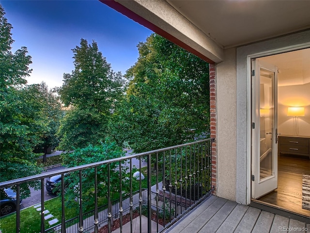 view of balcony at dusk
