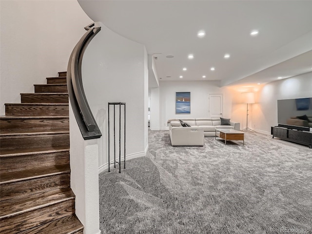 carpeted living area with stairs, recessed lighting, and baseboards