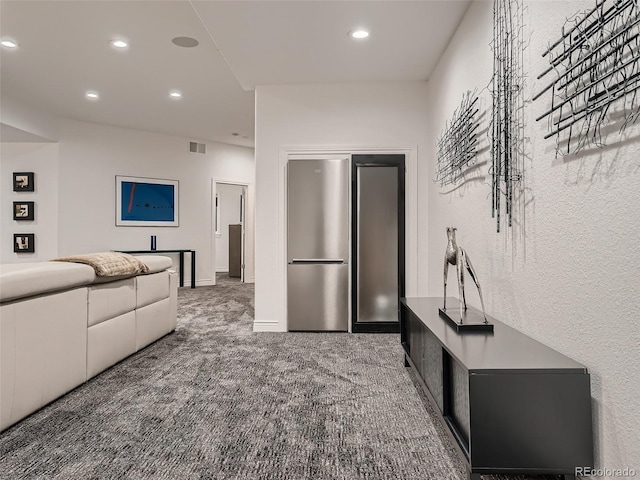 carpeted living room featuring recessed lighting and visible vents