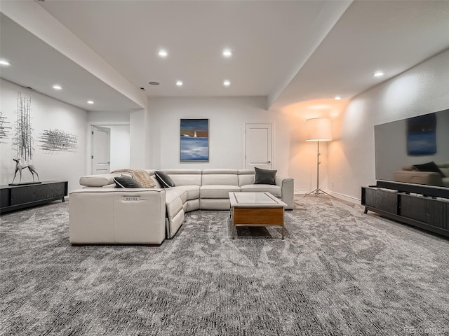 carpeted living area with recessed lighting