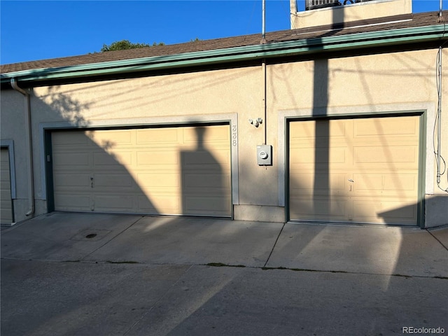 garage featuring driveway