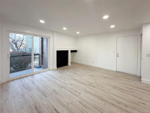 unfurnished living room featuring light hardwood / wood-style floors