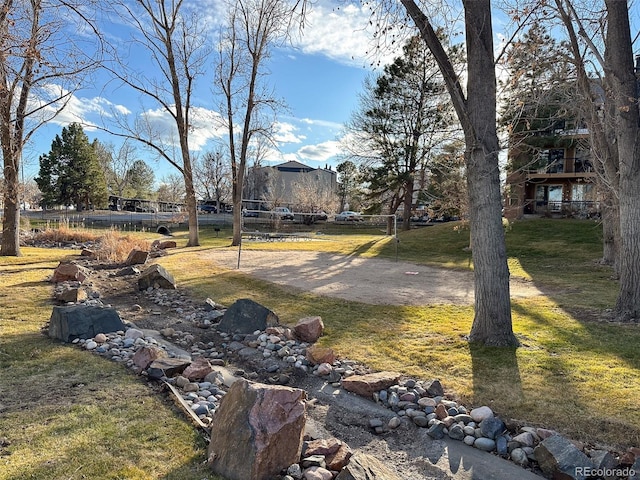 view of yard featuring volleyball court