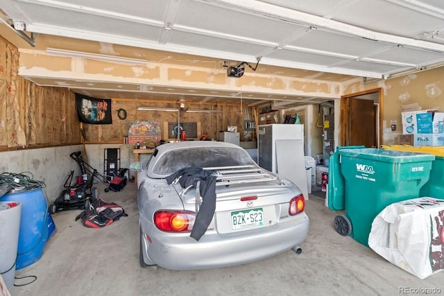 527 W Columbia St, Colorado Springs, CO 80907 - garage featuring a garage door opener