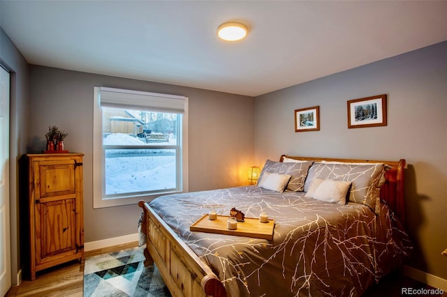 472 Ryan Gulch Rd, Silverthorne, CO 80498 - bedroom with baseboards and wood finished floors
