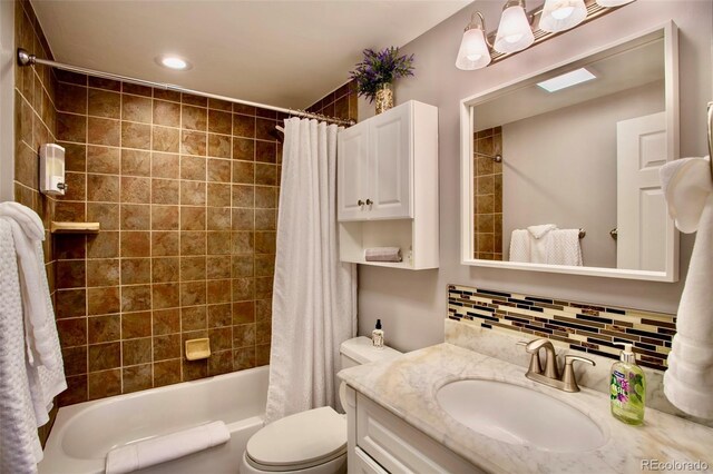 472 Ryan Gulch Rd, Silverthorne, CO 80498 - bathroom featuring backsplash, shower / bath combo, toilet, vanity, and recessed lighting