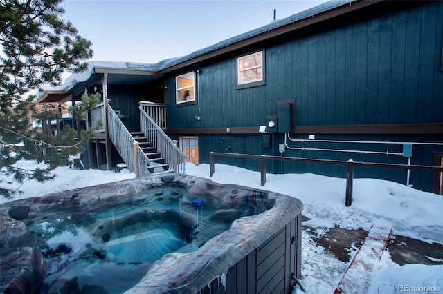 472 Ryan Gulch Rd, Silverthorne, CO 80498 - snow covered back of property with stairway and a hot tub