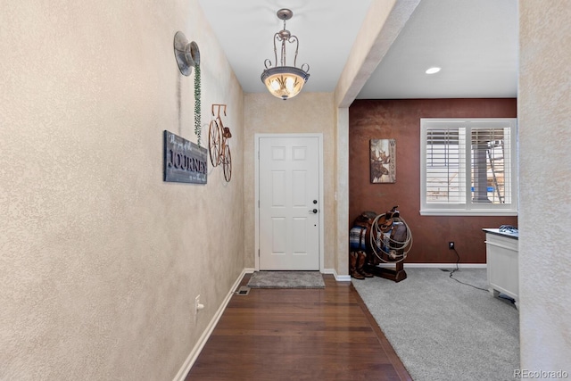 entryway with dark hardwood / wood-style floors