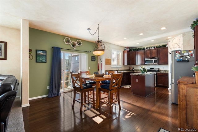 dining space featuring dark wood-type flooring