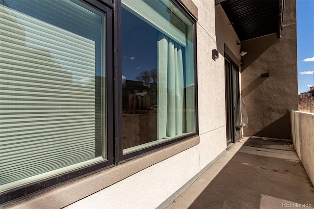 view of side of property with stucco siding