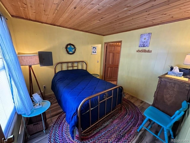 bedroom with wood ceiling, ornamental molding, electric panel, and hardwood / wood-style flooring