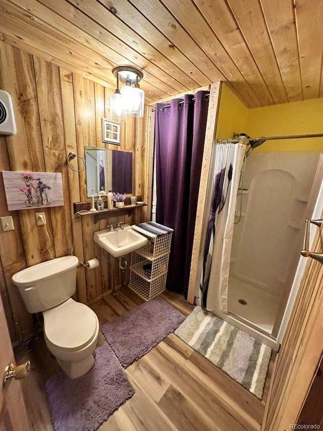 bathroom with sink, wood-type flooring, wooden ceiling, toilet, and walk in shower