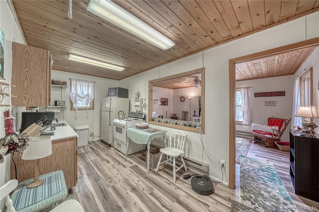 kitchen with wooden ceiling, light wood-style flooring, light countertops, and freestanding refrigerator