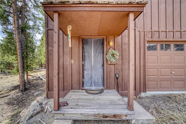 view of exterior entry featuring board and batten siding
