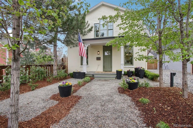view of front of house featuring fence