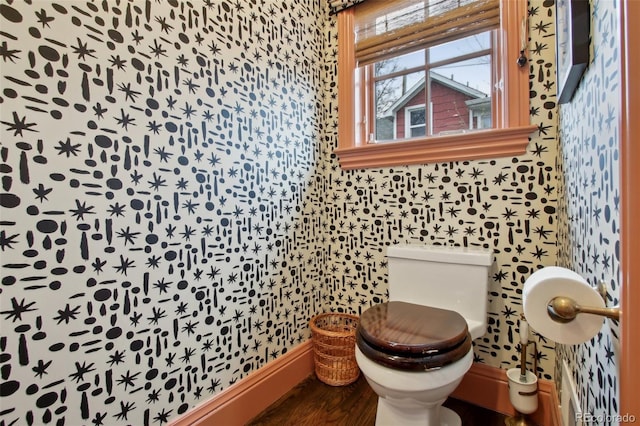 bathroom featuring toilet and wallpapered walls