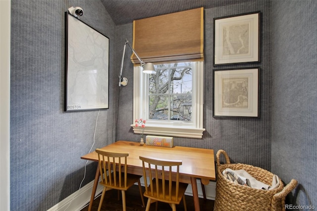 dining space with wallpapered walls