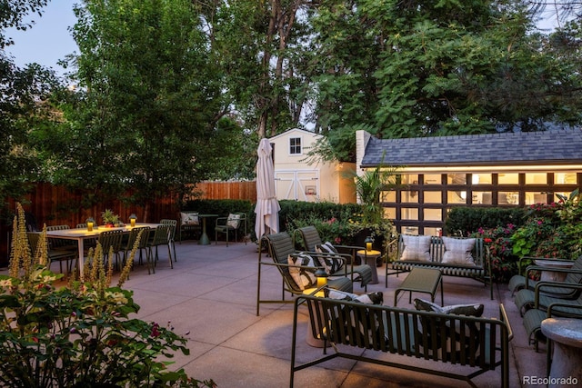 view of patio / terrace with a fenced backyard, an outdoor hangout area, and outdoor dining space