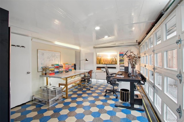 dining space with lofted ceiling, a healthy amount of sunlight, and tile patterned floors
